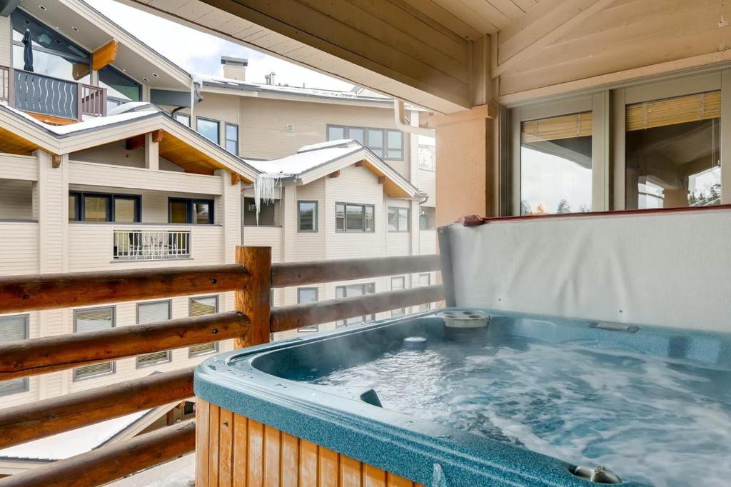 a hot tub on the balcony of a house at Mont Cervin 33 by AvantStay Luxury Ski in Ski out home in Park City in Park City