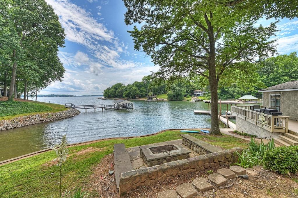 an estate on the river with a dock at Family Lake House Retreat by AvantStay Sleeps 28 in Mooresville