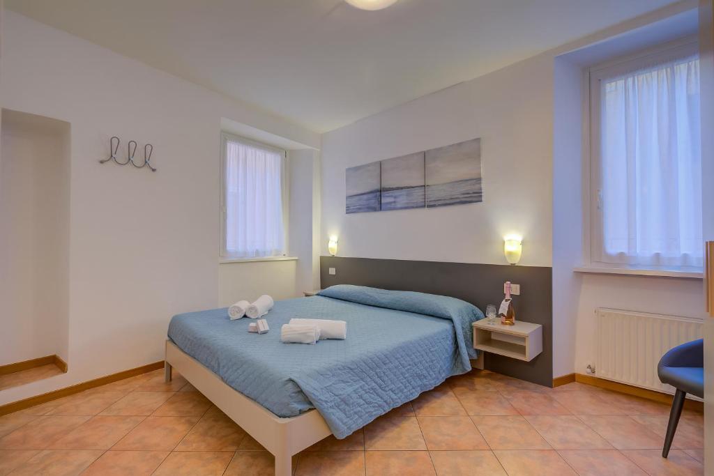 Łóżko lub łóżka w pokoju w obiekcie Casa Alpino