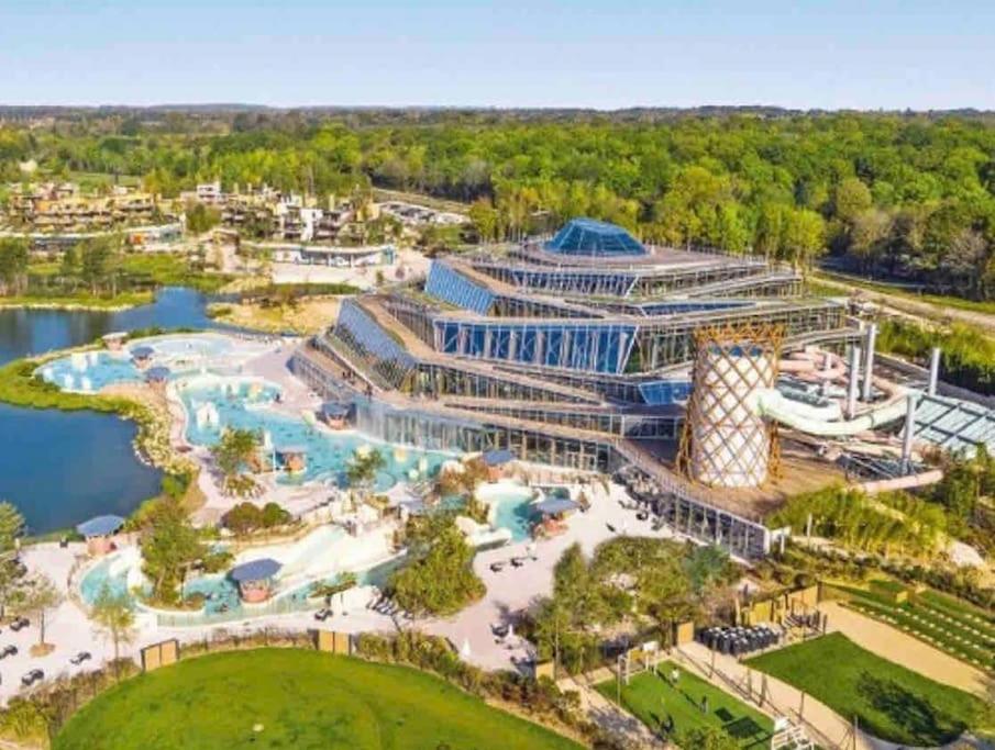 an aerial view of the water park at the resort at Appartement familial 8 personnes proche de Disney et Paris in Chessy