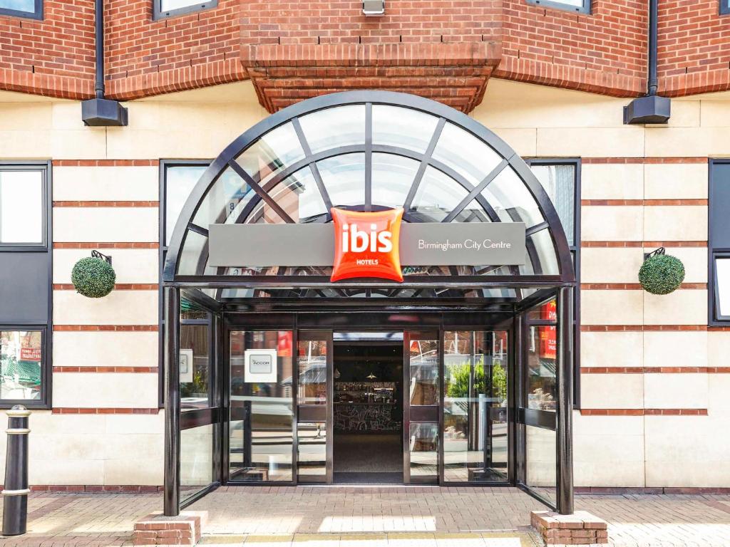 a ups store with a sign above the door at ibis Birmingham Centre New Street Station Hotel in Birmingham