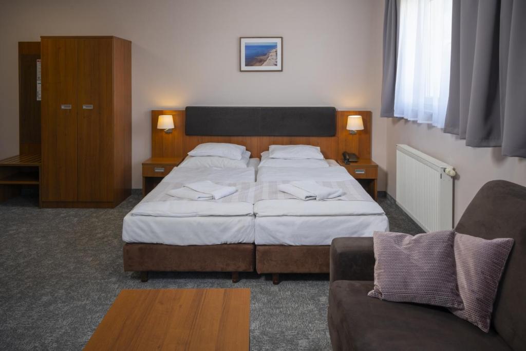 Postel nebo postele na pokoji v ubytování Maximus Spa
