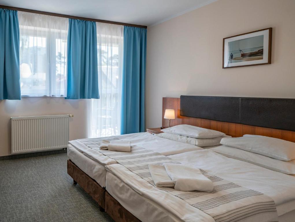 Postel nebo postele na pokoji v ubytování Maximus Spa