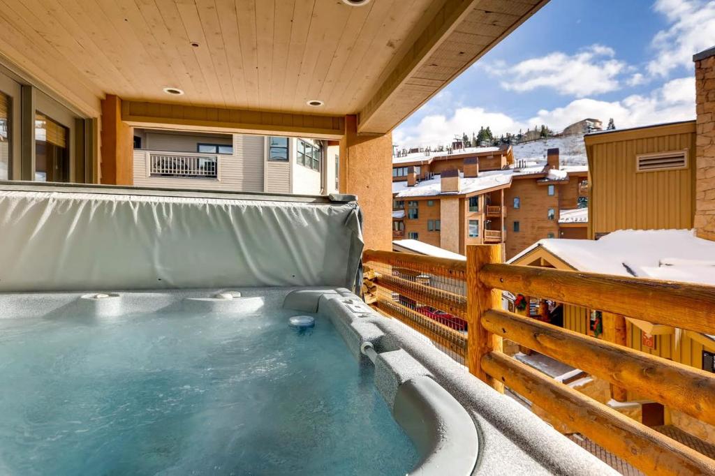 a hot tub on the balcony of a house at Mont Cervin 21 by AvantStay Luxury Ski in Ski out home in Park City in Park City