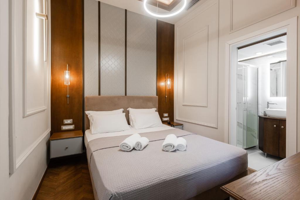 Postel nebo postele na pokoji v ubytování King Othon Boutique Hotel