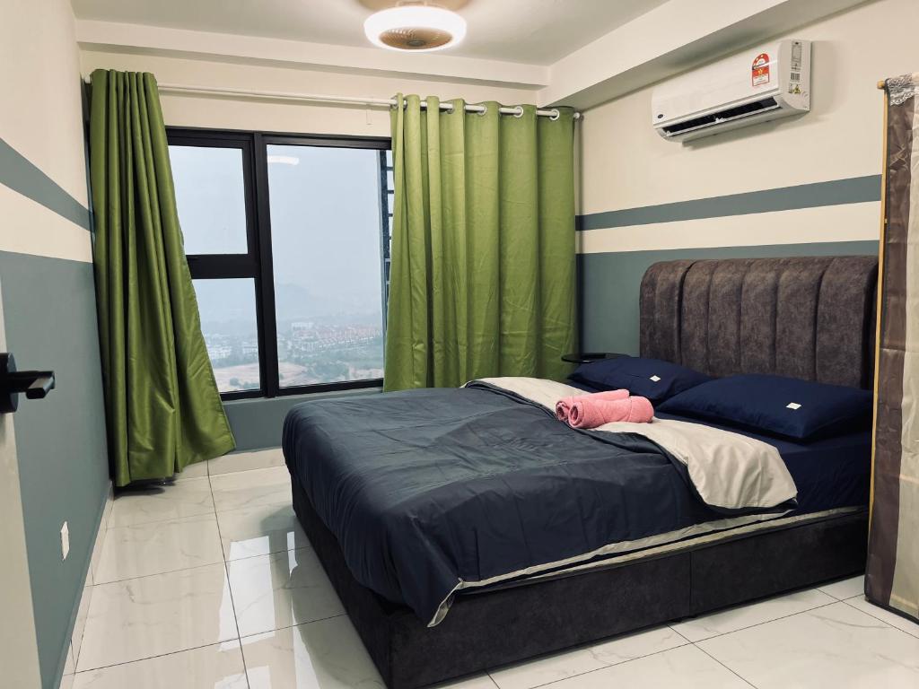 a bedroom with a bed with green curtains and a window at Arte cheras luxury family house link MRT in Kuala Lumpur