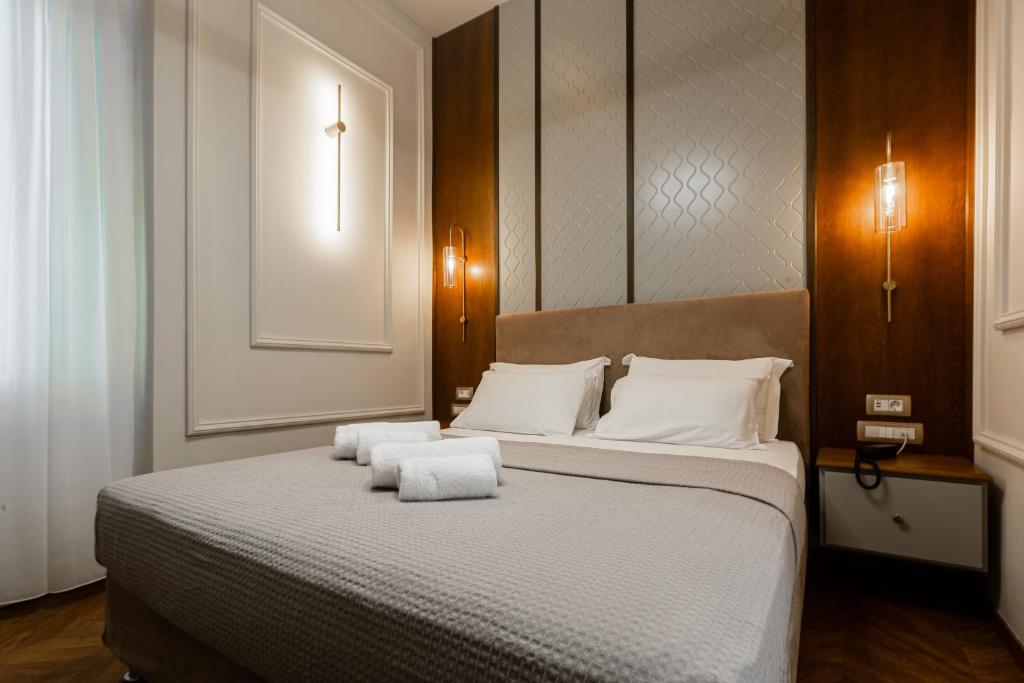 Postel nebo postele na pokoji v ubytování King Othon Boutique Hotel