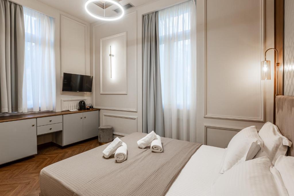 Postel nebo postele na pokoji v ubytování King Othon Boutique Hotel