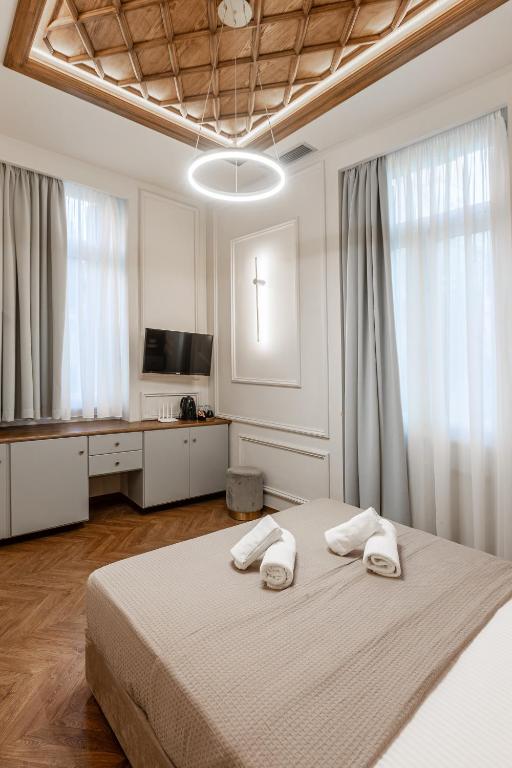 Postel nebo postele na pokoji v ubytování King Othon Boutique Hotel