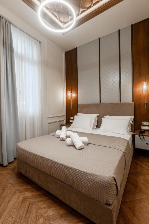 Postel nebo postele na pokoji v ubytování King Othon Boutique Hotel