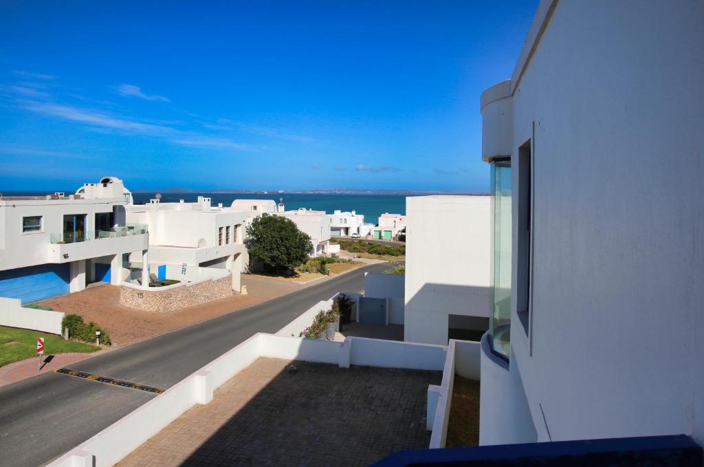 a view from the balcony of a white building at Dalene se Seehuis, Langebaan, 8-sleeper in Langebaan