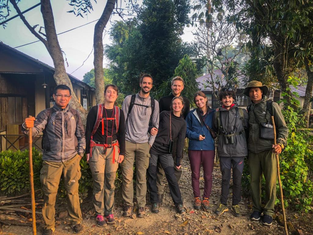 a group of people posing for a picture at Hotel Tharu Garden And Beer Bar in Chitwan
