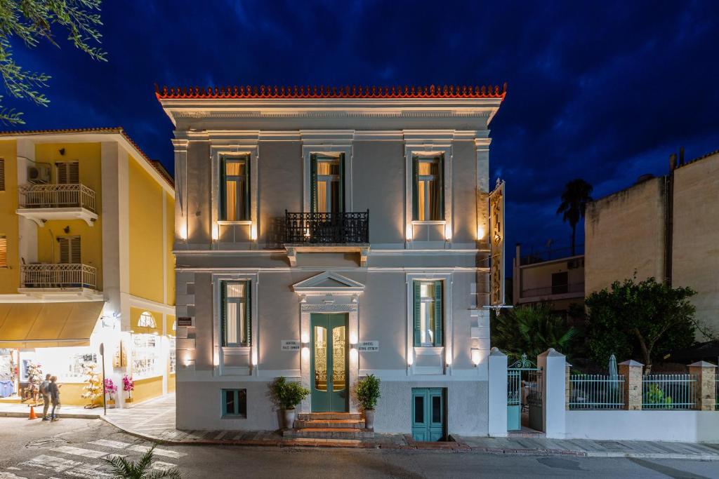 a white house with lights on at King Othon Boutique Hotel in Nafplio