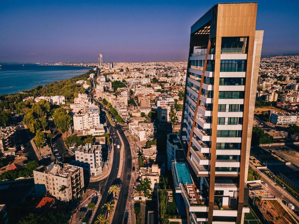 a view of a city with a tall building at The Icon Limassol in Limassol