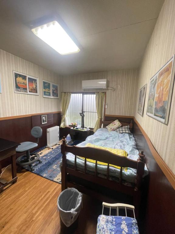 Postel nebo postele na pokoji v ubytování Jiji-Baba house