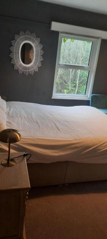 Postel nebo postele na pokoji v ubytování Boutique Guest House