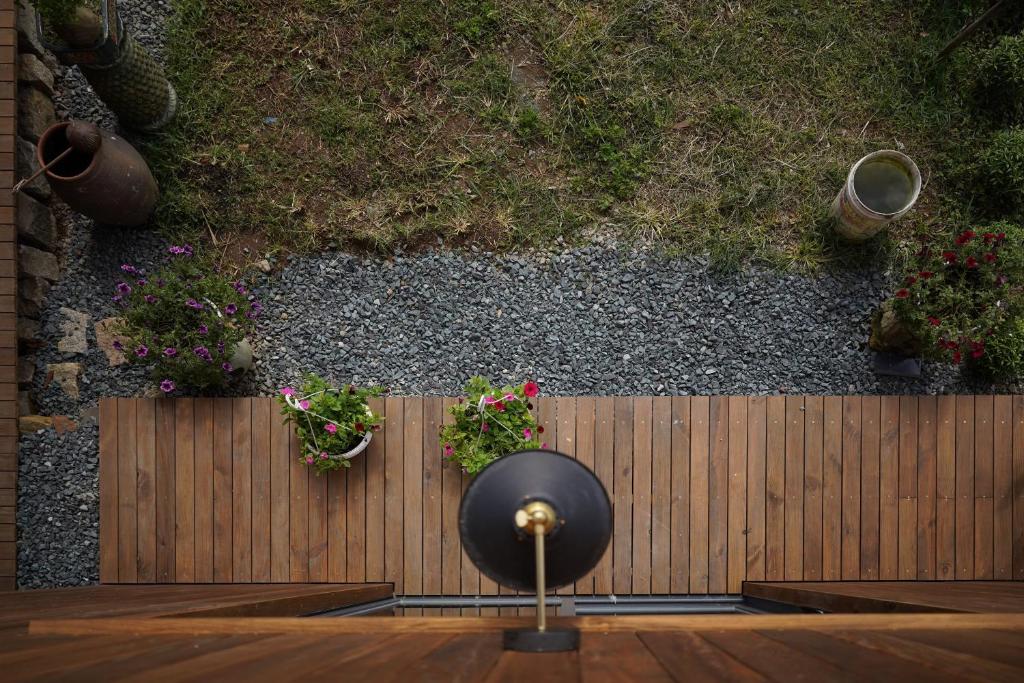 an overhead view of a wooden fence with potted plants at Dalaha Retreat in Da Thien