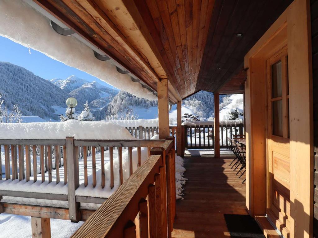 a porch of a cabin with a view of the mountains at Chalet contemporain 8 pers, 4 chambres, vue sur montagnes, parking, près village - FR-1-342-243 in Beaufort