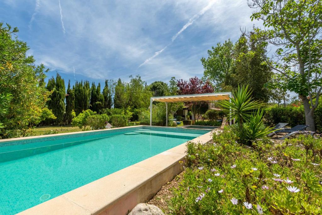 a swimming pool in a garden with a gazebo at Selva - 4101 Mallorca in Selva