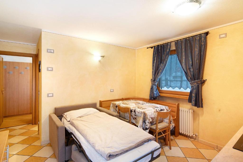 Postel nebo postele na pokoji v ubytování Appartamento Cima Cavalli
