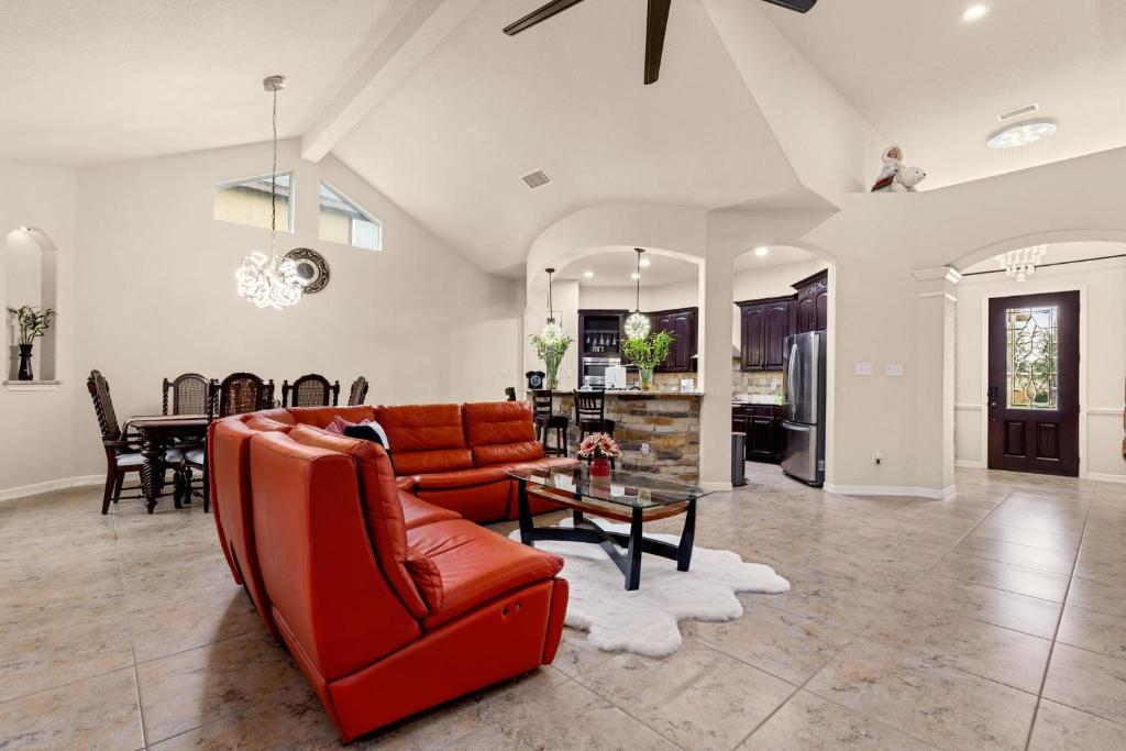 a living room with a couch and a table at Randolph Central Location, 1-story, Chef Kitchen, Creekside in Selma