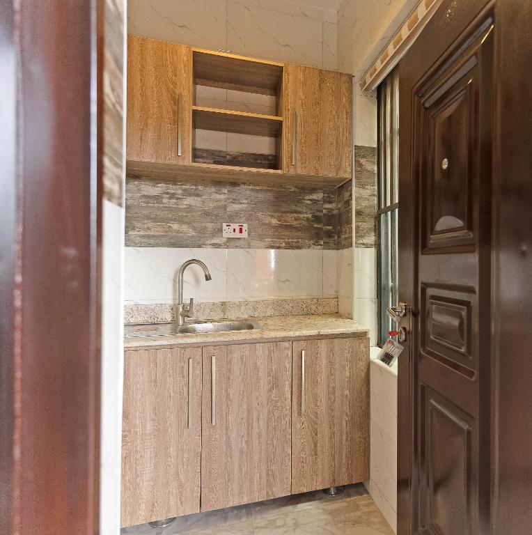 Kuchyň nebo kuchyňský kout v ubytování God's Touch Apartments Remi Fani Kayode GRA. Ikeja