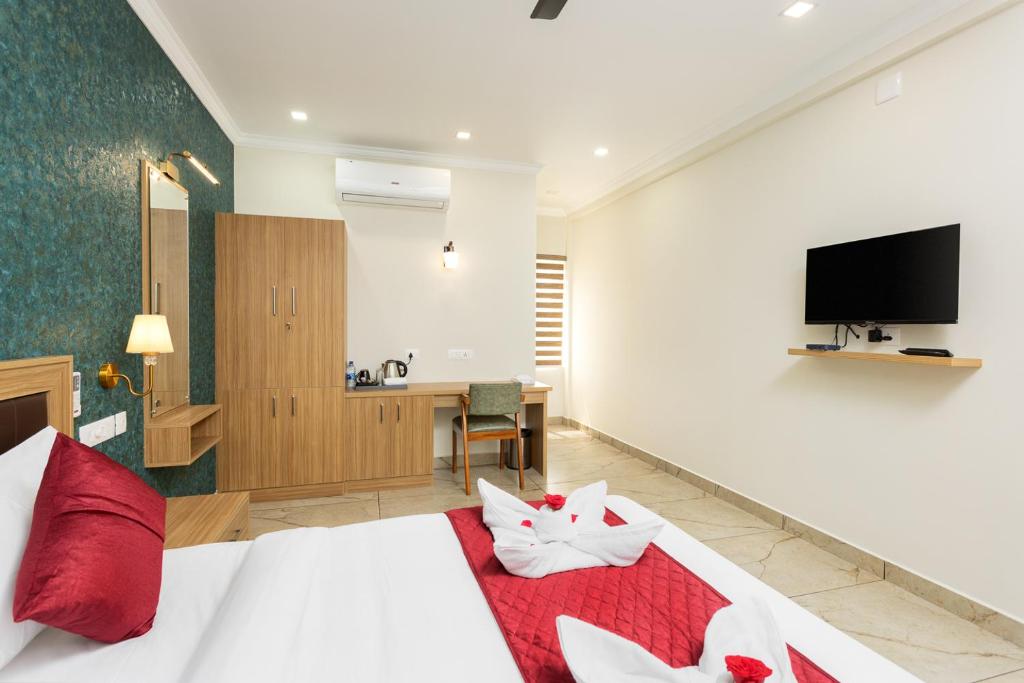 TV a/nebo společenská místnost v ubytování ESAA Airport Hotel