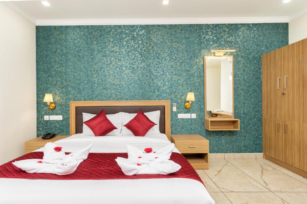 Postel nebo postele na pokoji v ubytování ESAA Airport Hotel
