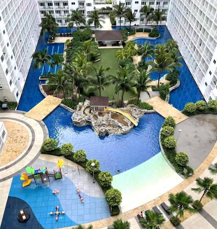 an aerial view of a resort with a water park at Mall of Asia Shore Dynastel Staycation in Manila