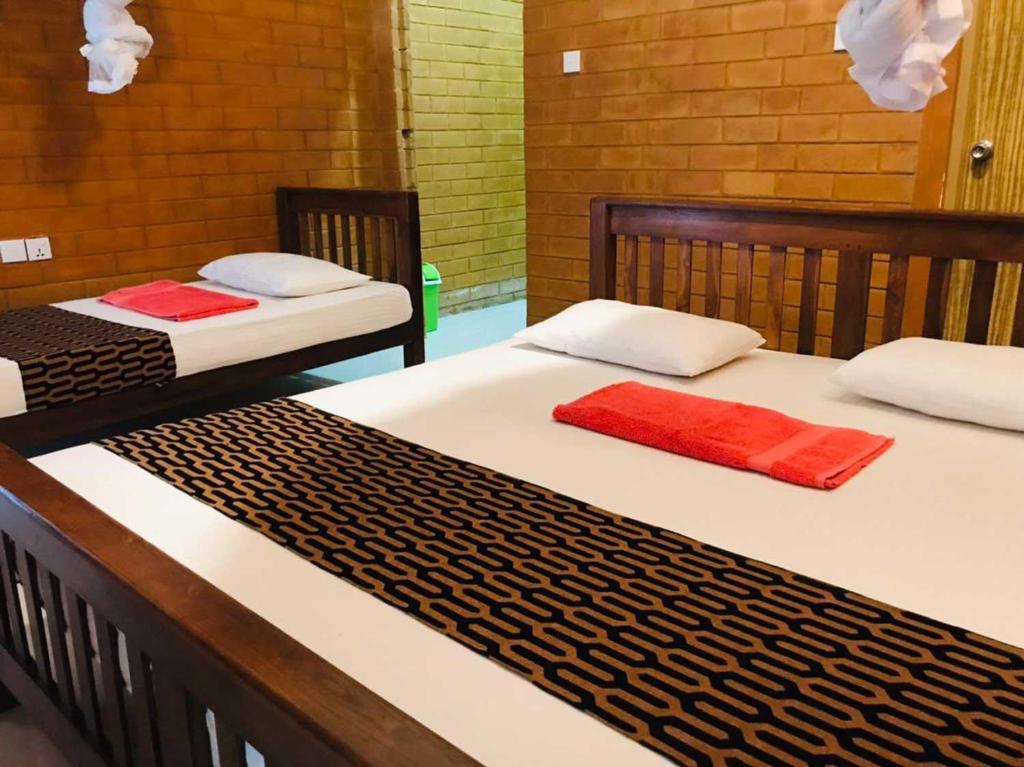 Postel nebo postele na pokoji v ubytování Anuradhapura Kanimadala Resort