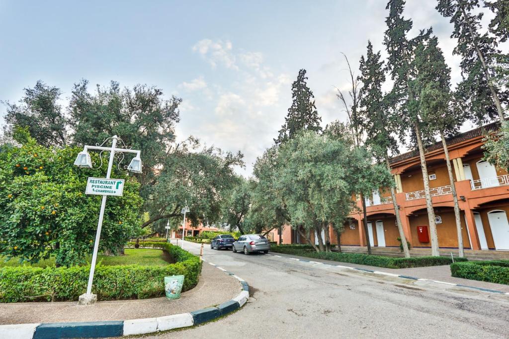 a street with a cross on the side of the road at Complexe El Bassatine in Beni Mellal
