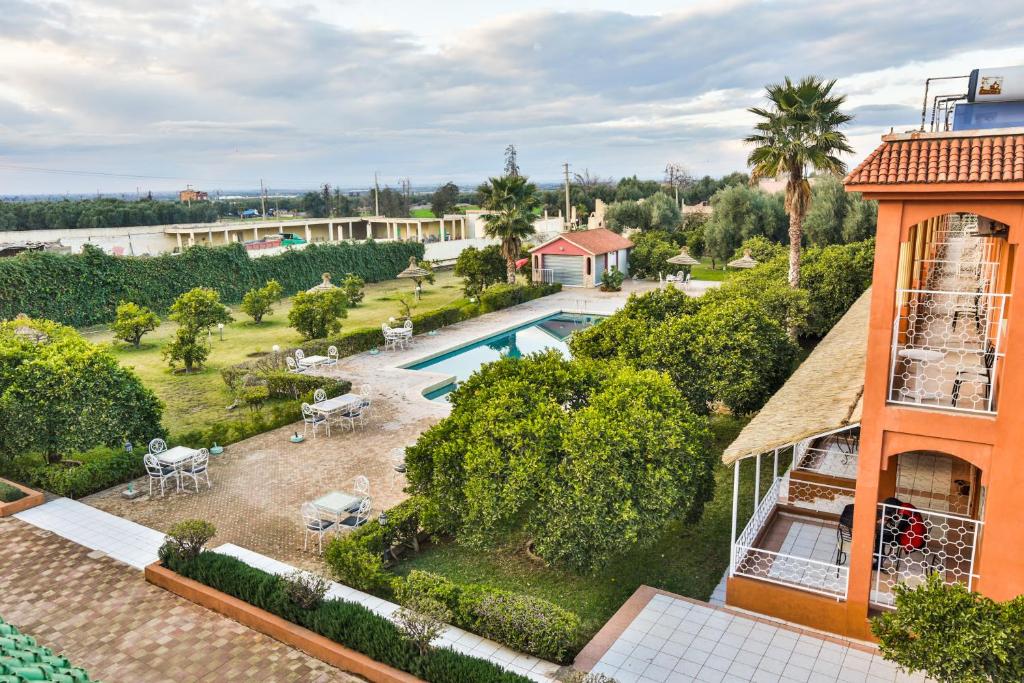 an aerial view of the backyard of a house with a swimming pool at Complexe El Bassatine in Beni Mellal