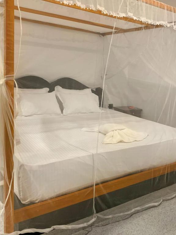 Postel nebo postele na pokoji v ubytování Golden Wave