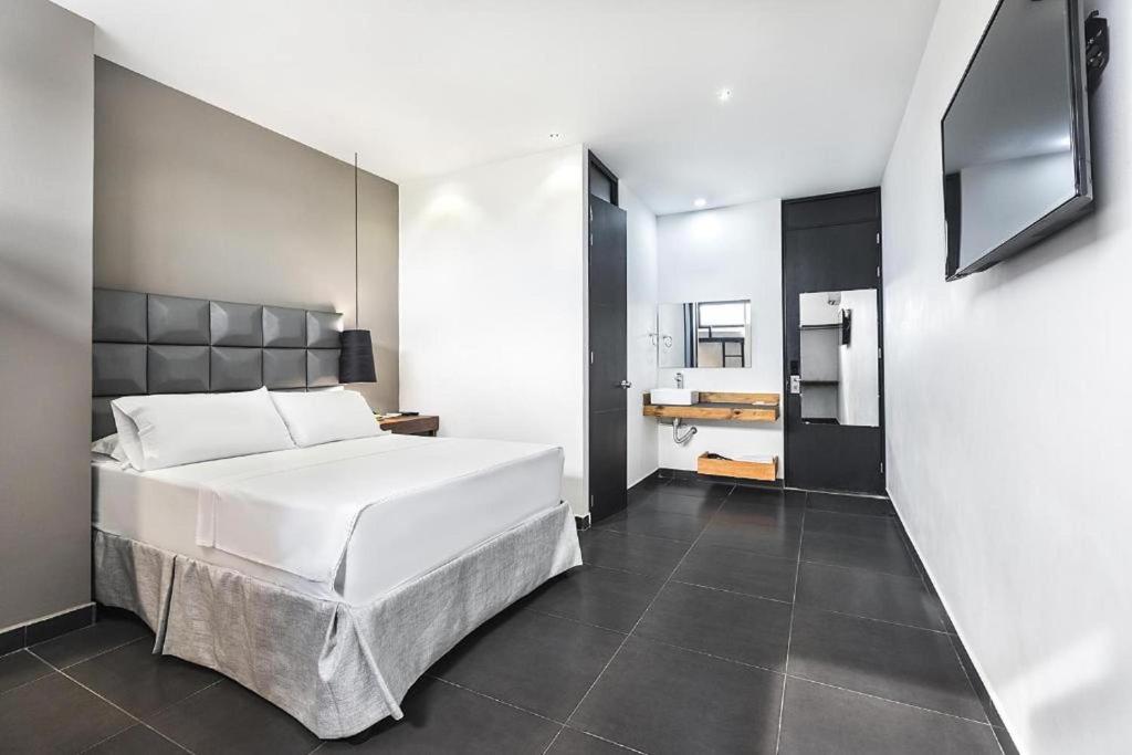 Uma cama ou camas num quarto em Hotel Cartagena DC
