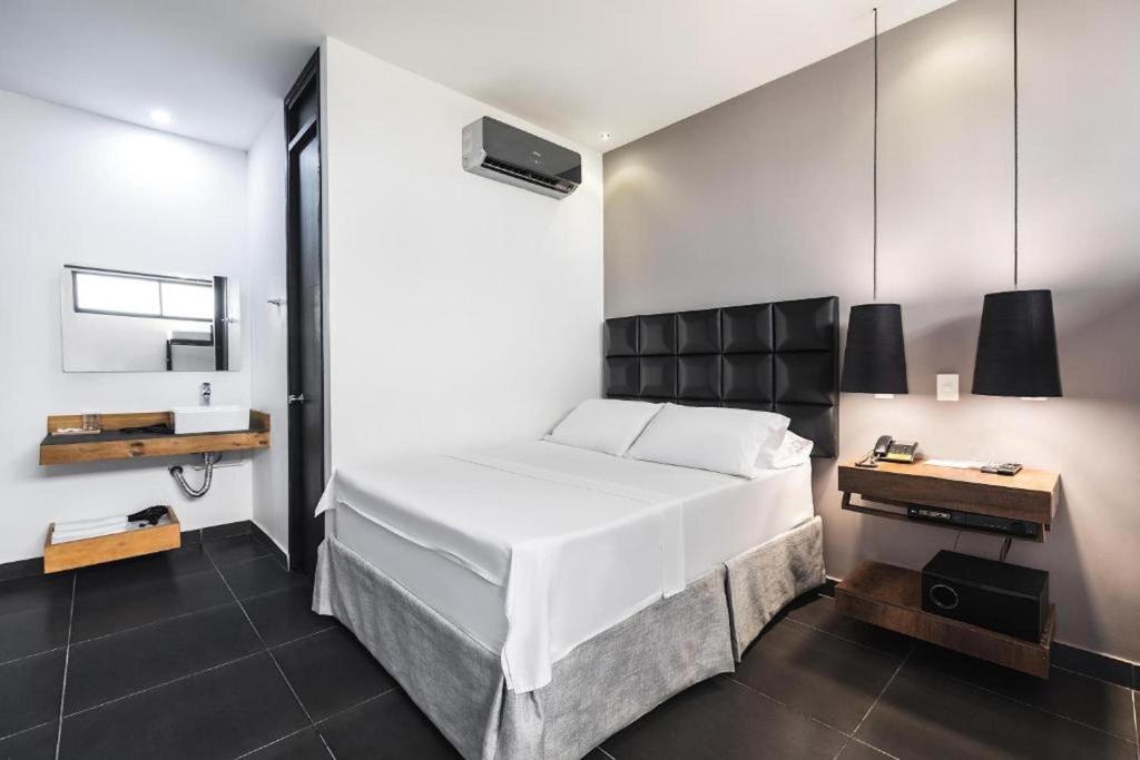 Uma cama ou camas num quarto em Hotel Cartagena DC