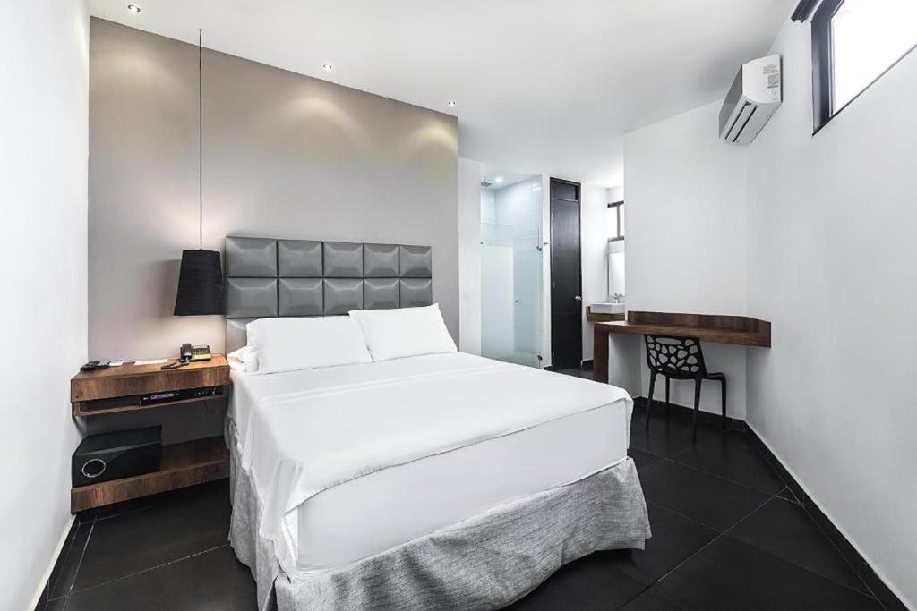Uma cama ou camas num quarto em Hotel Cartagena DC