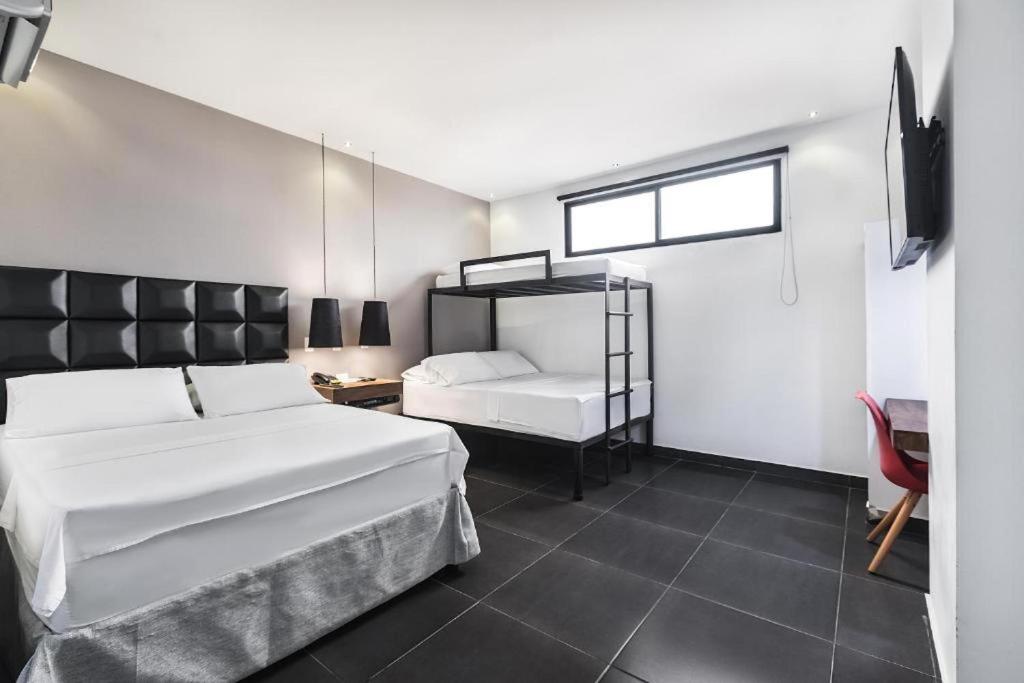 Uma cama ou camas num quarto em Hotel Cartagena DC