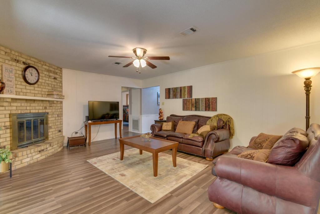 a living room with a couch and a fireplace at Beaumont Rental Home about 2 Mi to Gulf Terrace Park! in Beaumont