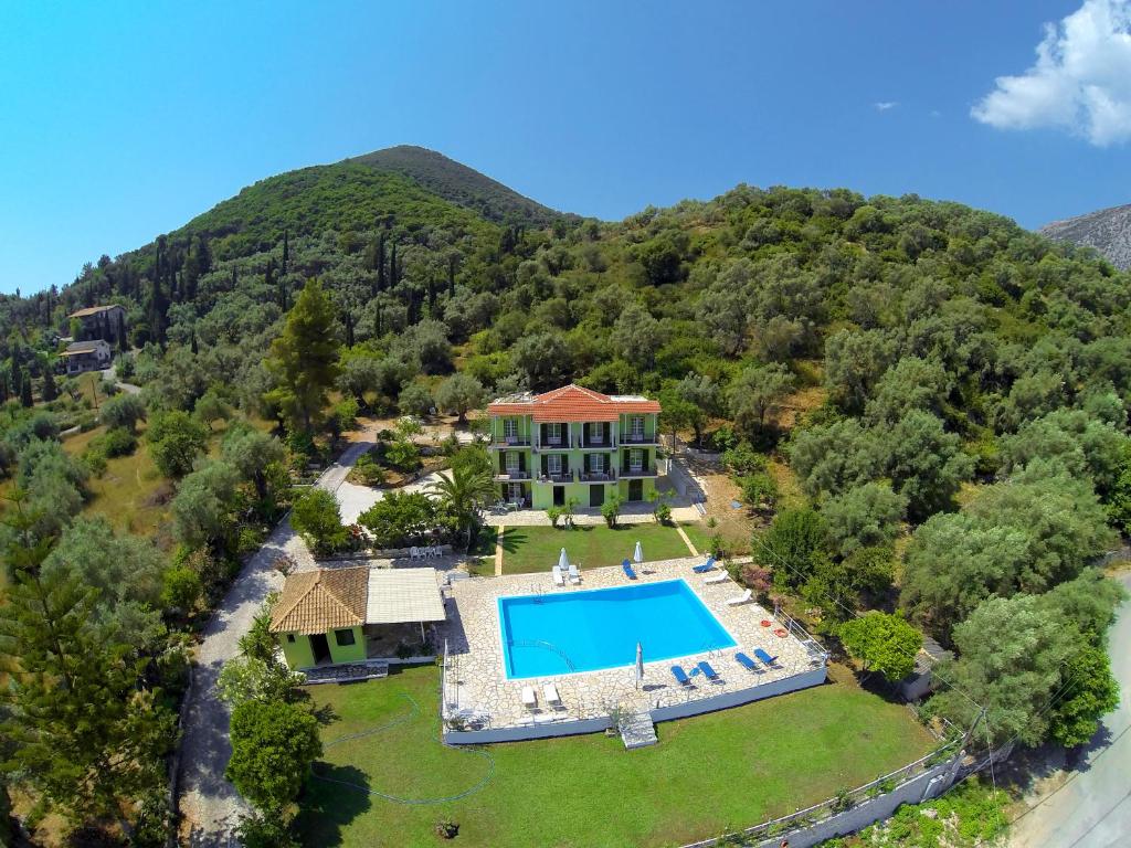 an aerial view of a house with a swimming pool at Vliho Bay Suites & Apartments in Yénion