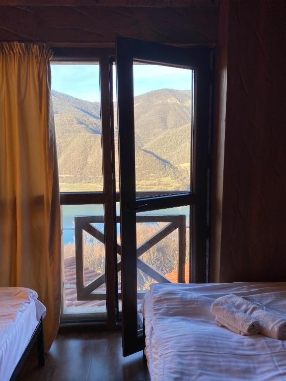 Postel nebo postele na pokoji v ubytování Hotel Ananuri