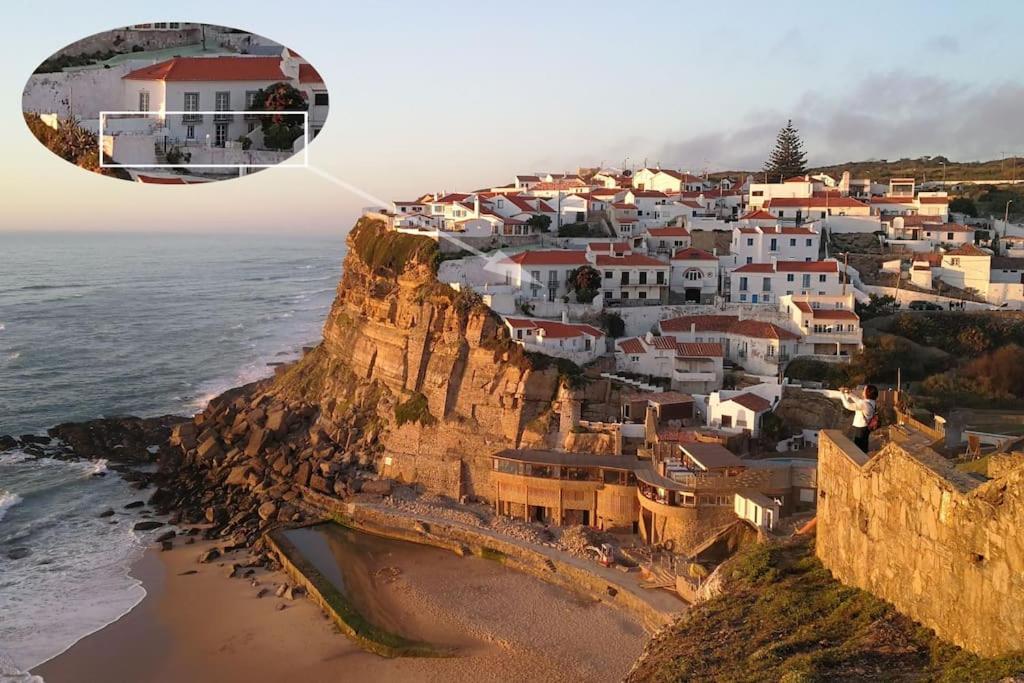 una vista aérea de un pueblo en un acantilado junto al océano en Casa Condessa - Create memories, en Azenhas do Mar