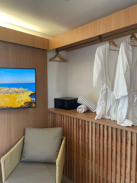 TV a/nebo společenská místnost v ubytování Santa Aldeia Hotel