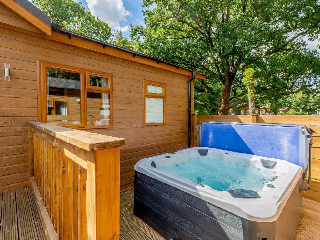 a hot tub on the deck of a house at 2 bed property in Okehampton 86870 in Okehampton