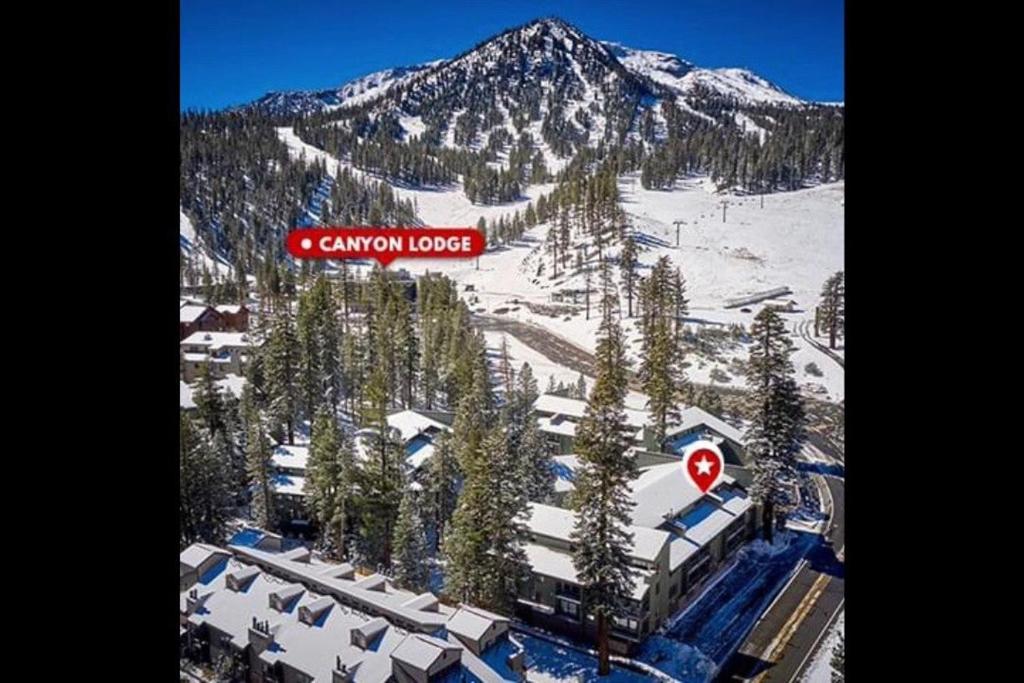 a mountain lodge with a sign that reads canyon lodge at St Anton Condos #77 condo in Mammoth Lakes
