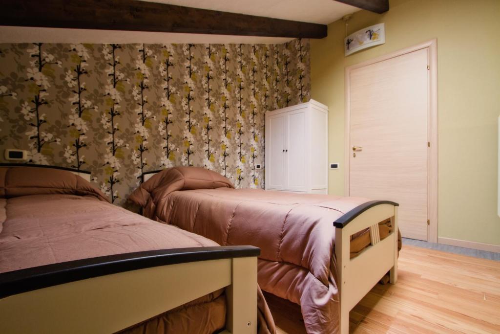 Postel nebo postele na pokoji v ubytování B&B Casa Arcangeli