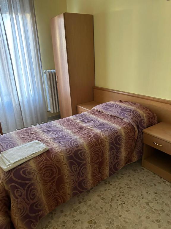 Postel nebo postele na pokoji v ubytování Albergo pensione Bianco