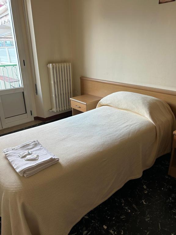 Postel nebo postele na pokoji v ubytování Albergo pensione Bianco