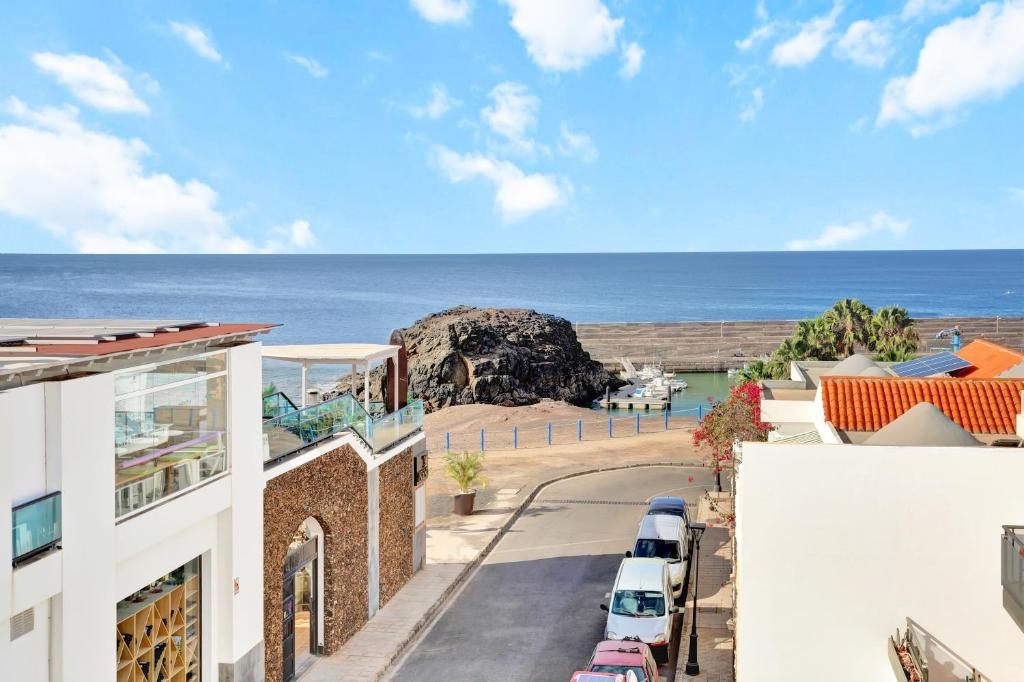 a view of the ocean from a building at SunsetView apartment El Cotillo 2-4 personas in Cotillo