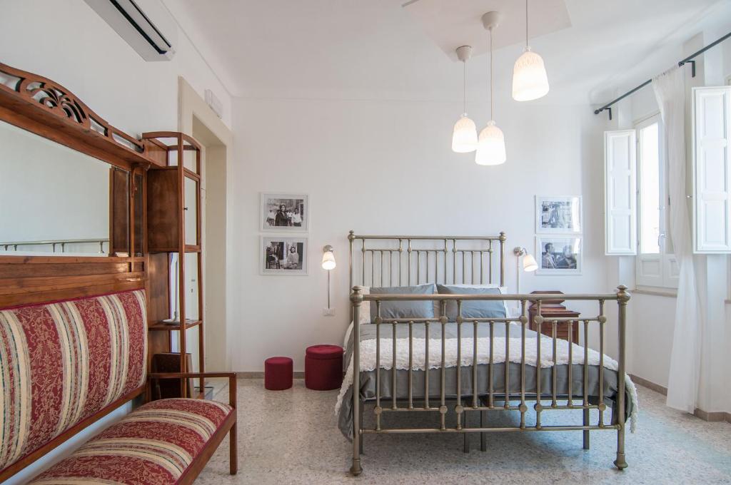 Posteľ alebo postele v izbe v ubytovaní B&B Novecento Siciliano