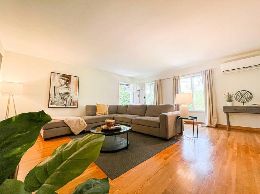 a living room with a couch and a table at Family-Friendly 2BR in Quiet Area -AM1 in Los Angeles